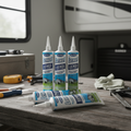 Four tubes of Sashco Lexel clear adhesive caulk for RV maintenance