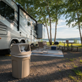 Suncast outdoor trash can at an RV campsite