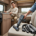 USB-C rechargeable cordless car vacuum with attachments being used in RV interior